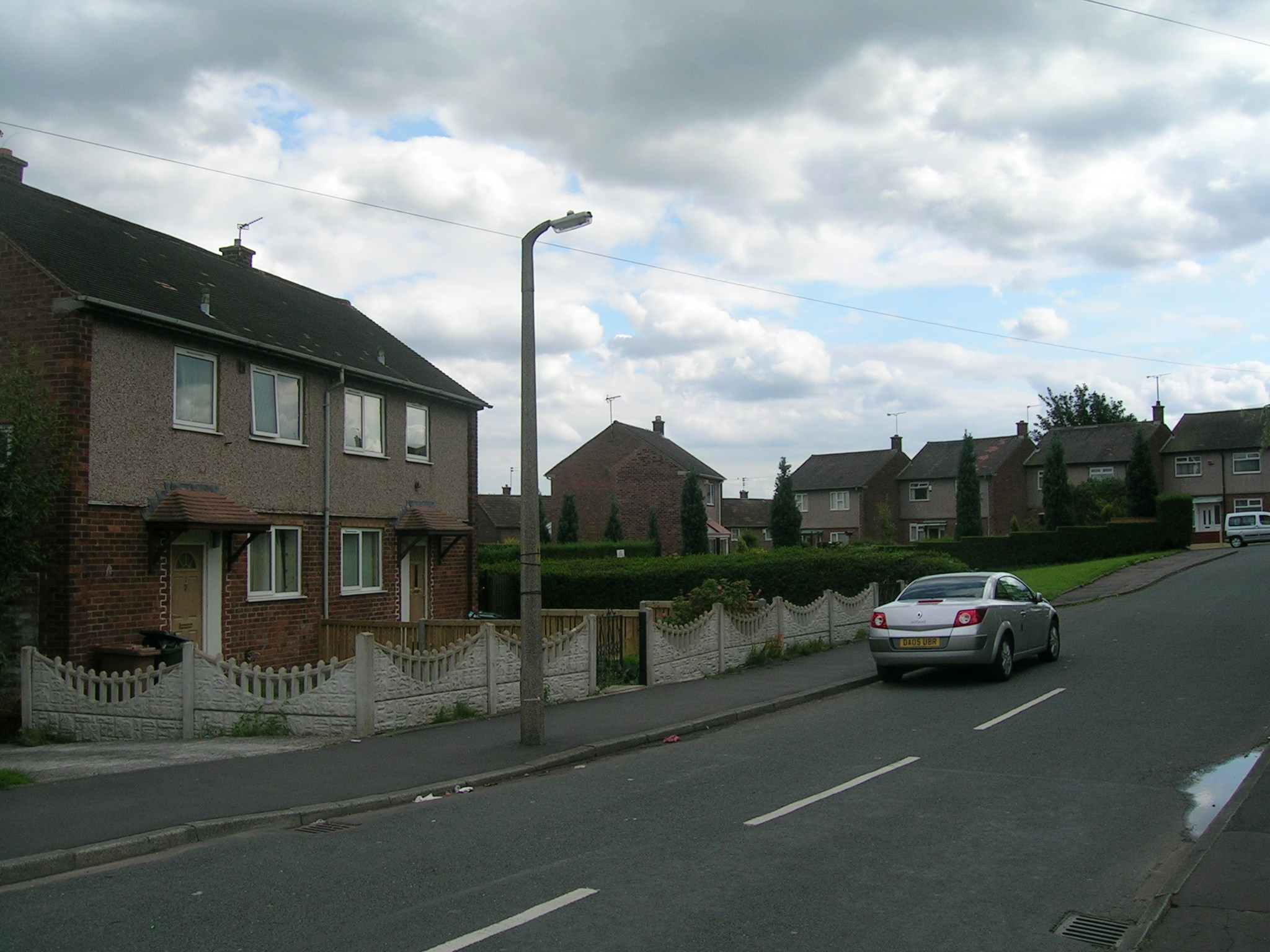 an image of cars parked in front of some houses