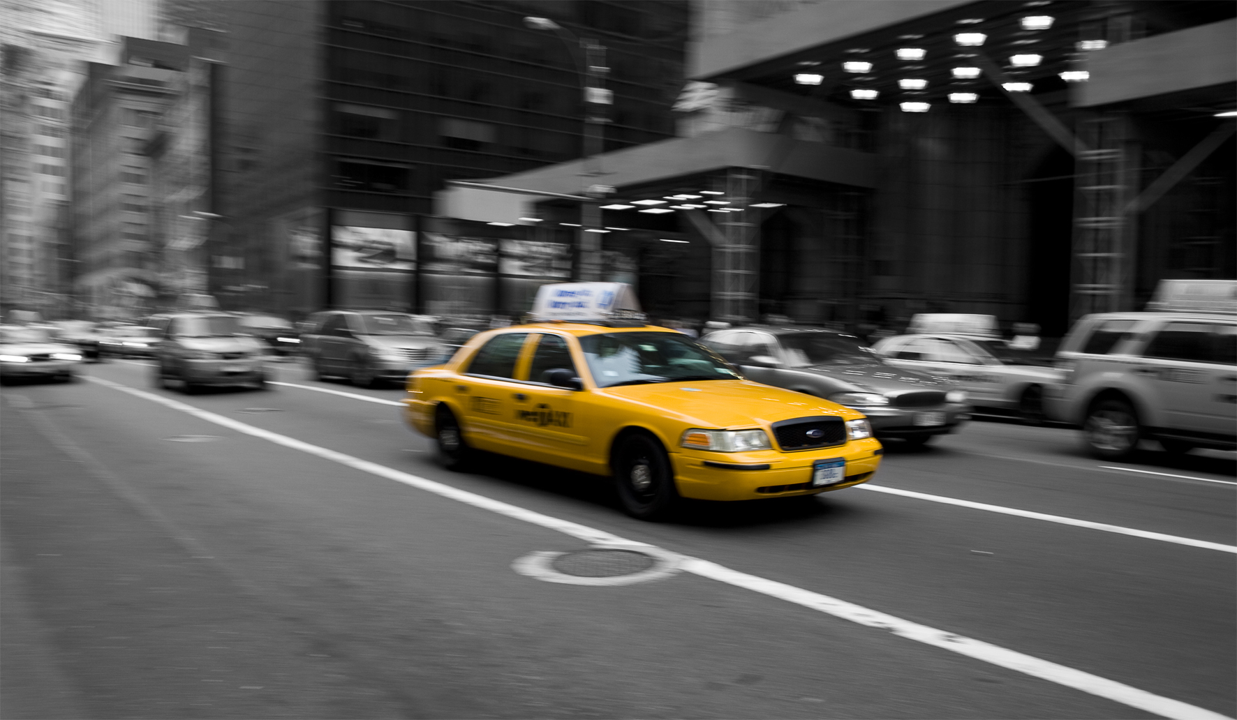 the taxi cab is yellow with its roof raised