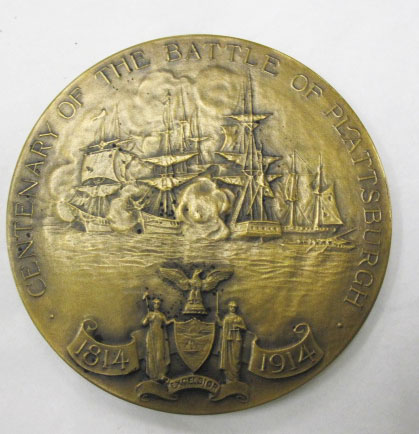 an old ss medal with ship scene on it