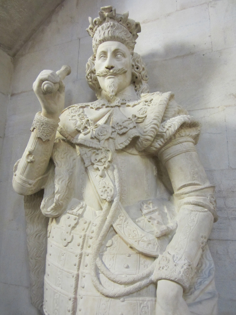 a statue in the shape of a man in renaissance attire
