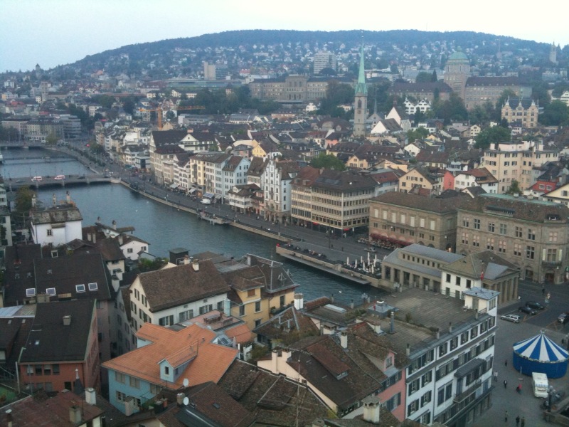 a city with an old dock next to a river