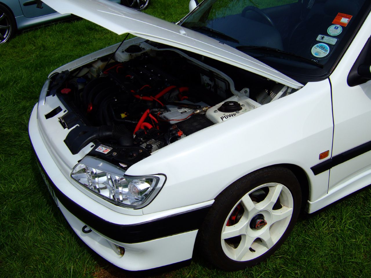 the engine compartment of a car with many components in it