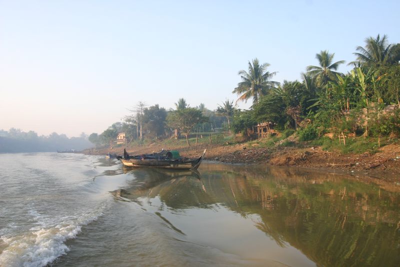 boats sit on the river as it is low on land