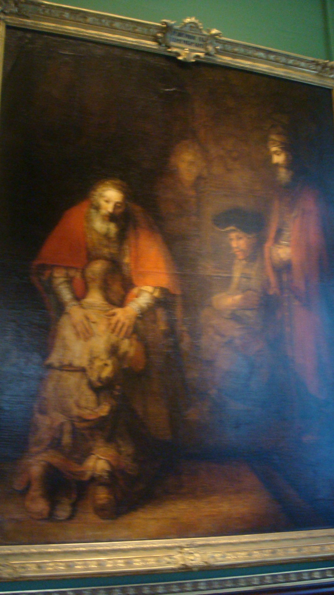 a painting depicting a figure on display inside a museum