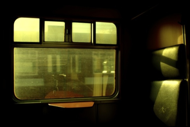 view from the window on the side of a train