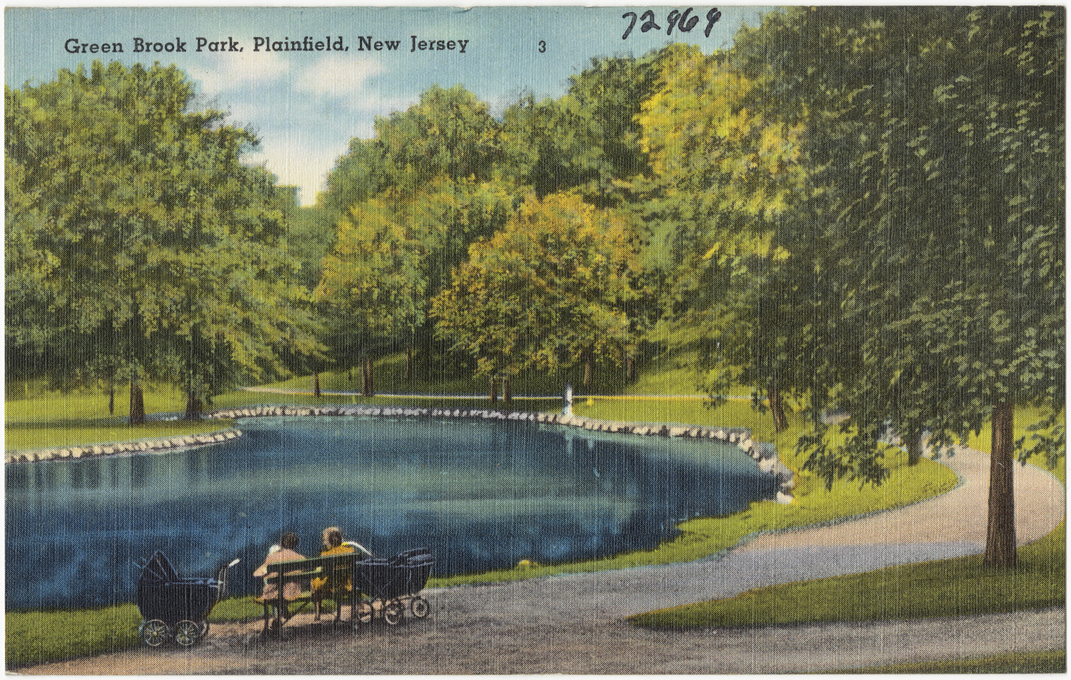 two people sit on the bench in front of a lake