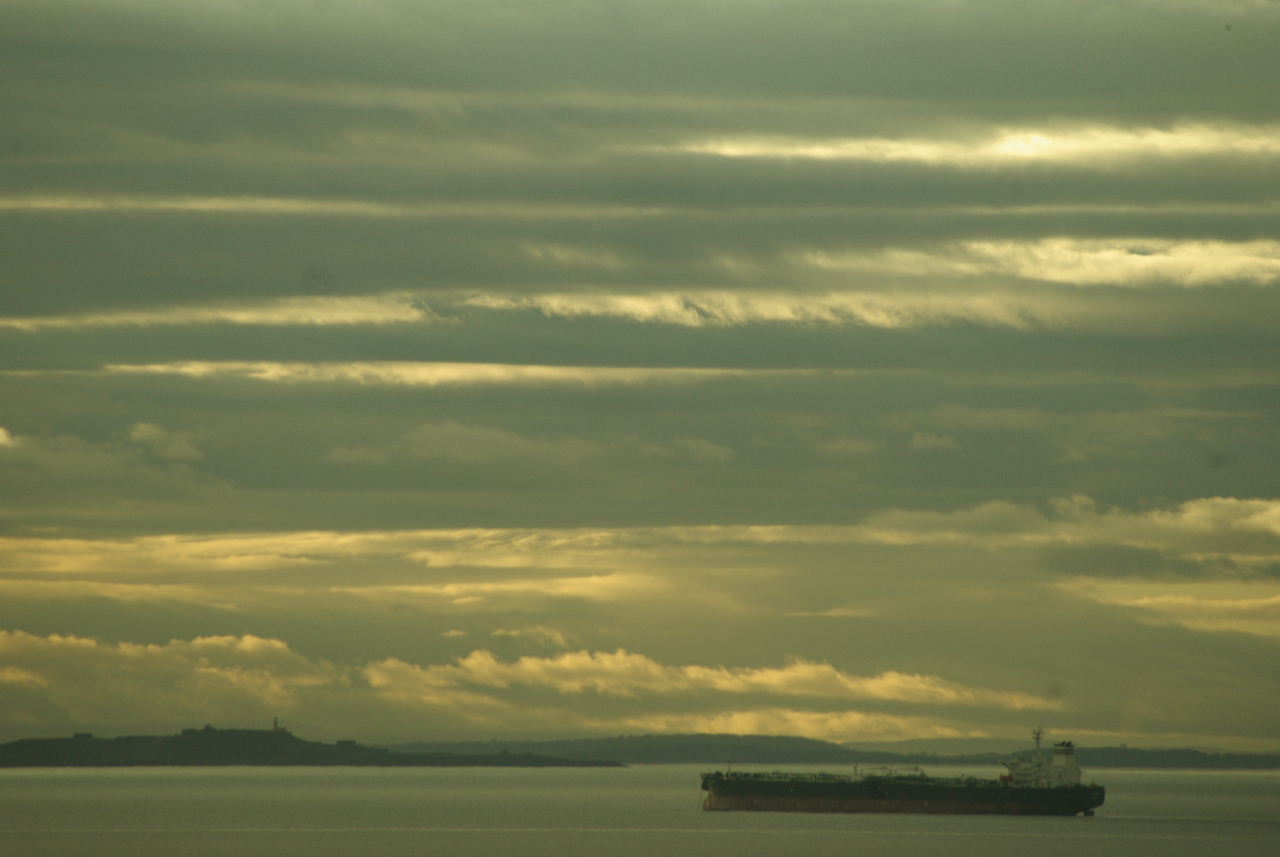 large tanker ship heading out to sea for shipping