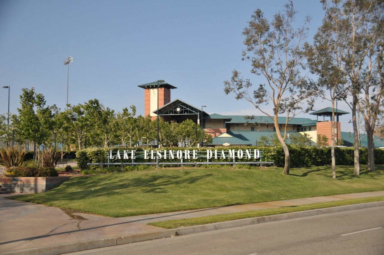 the entrance to lake harmony mall with grass and bushes in front