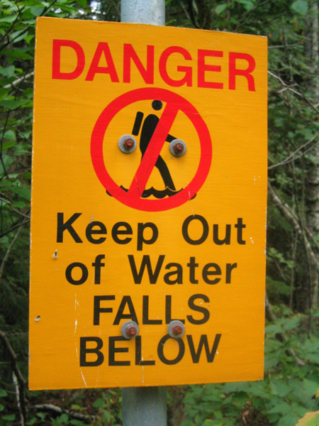 a warning sign that indicates danger to people
