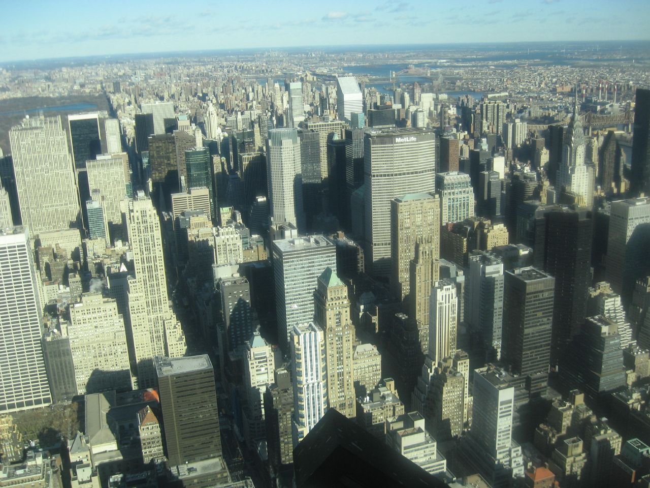 an aerial view of the city of manhattan, looking down on empire