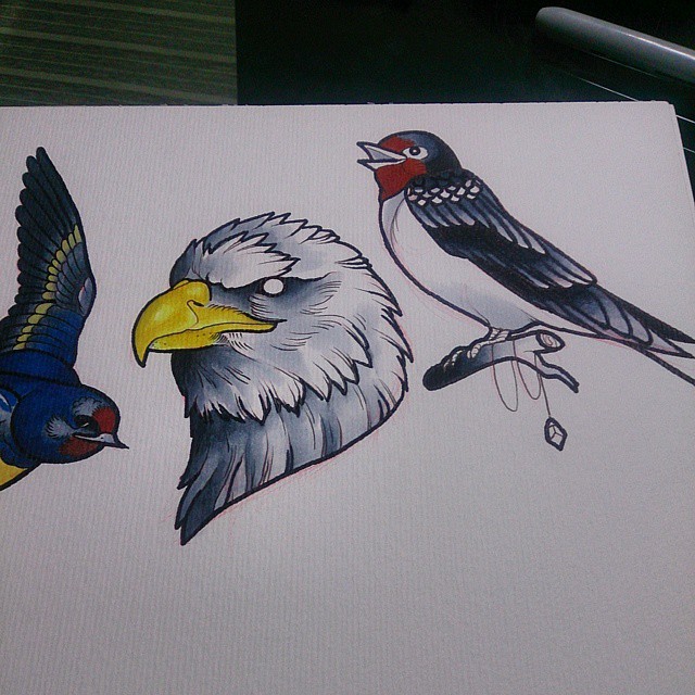 a drawing of some birds on white paper