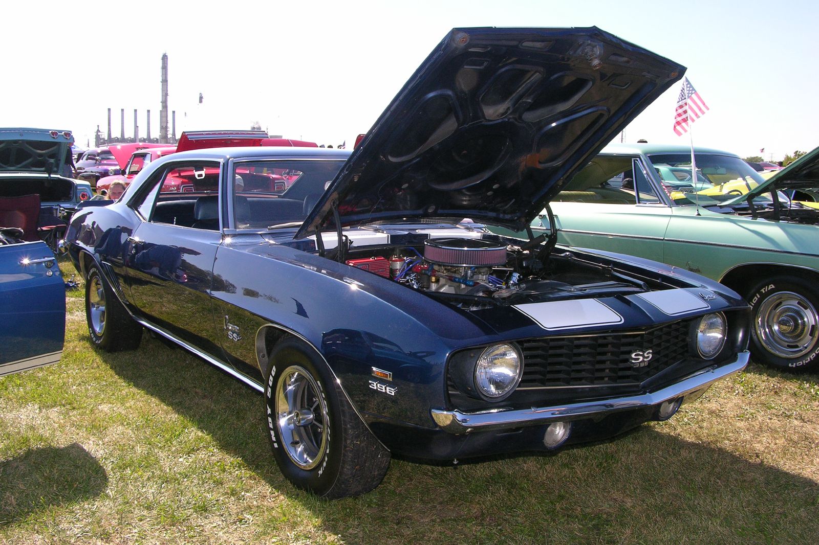 a vintage ford mustang at a car show