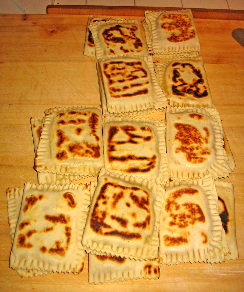 an assortment of uncooked flatbreads laid out in a pattern