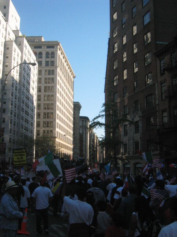 a group of people walking across a street