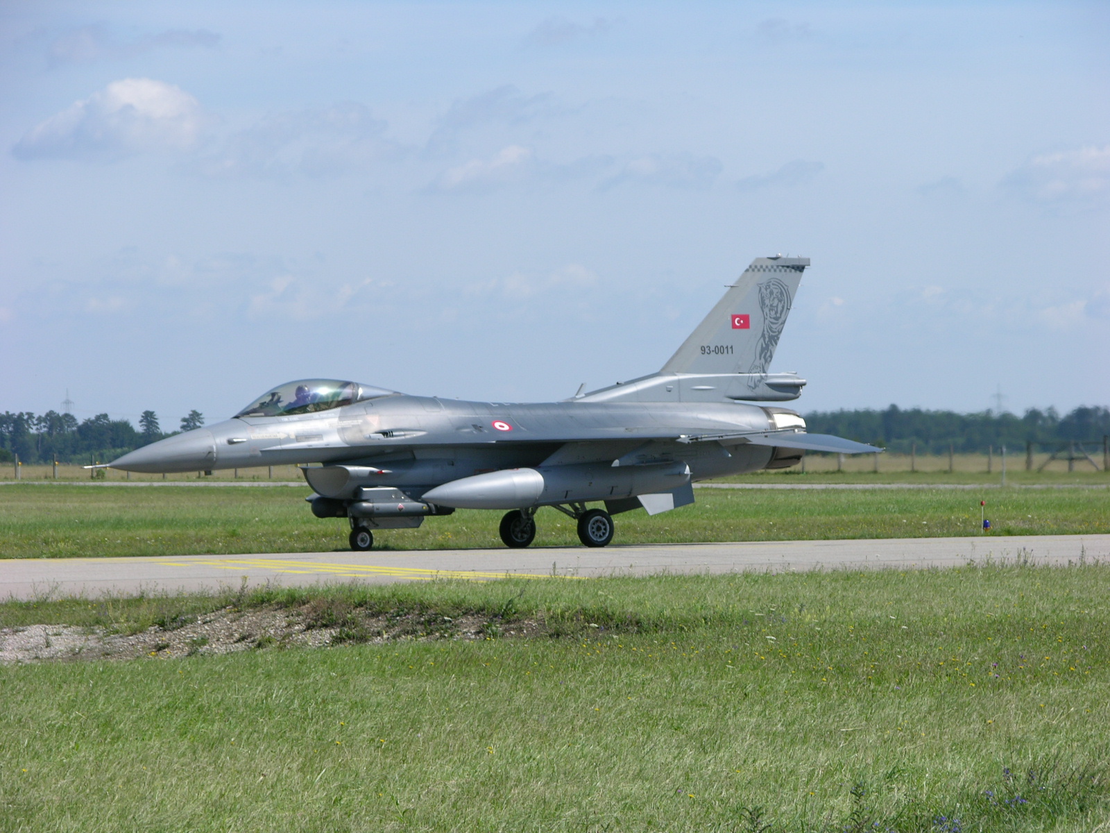 a jet is sitting on a runway ready to take off