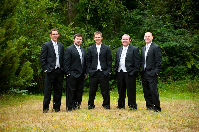 six young men dressed in formal clothing pose for a picture