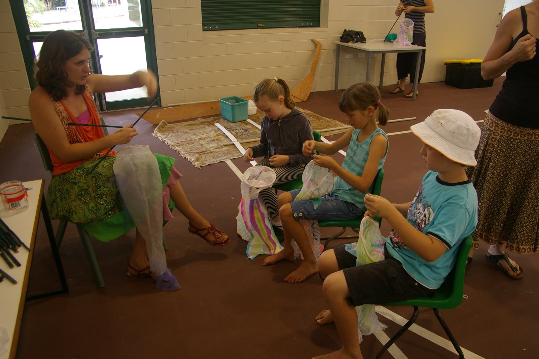 a group of s sit in chairs together and learn