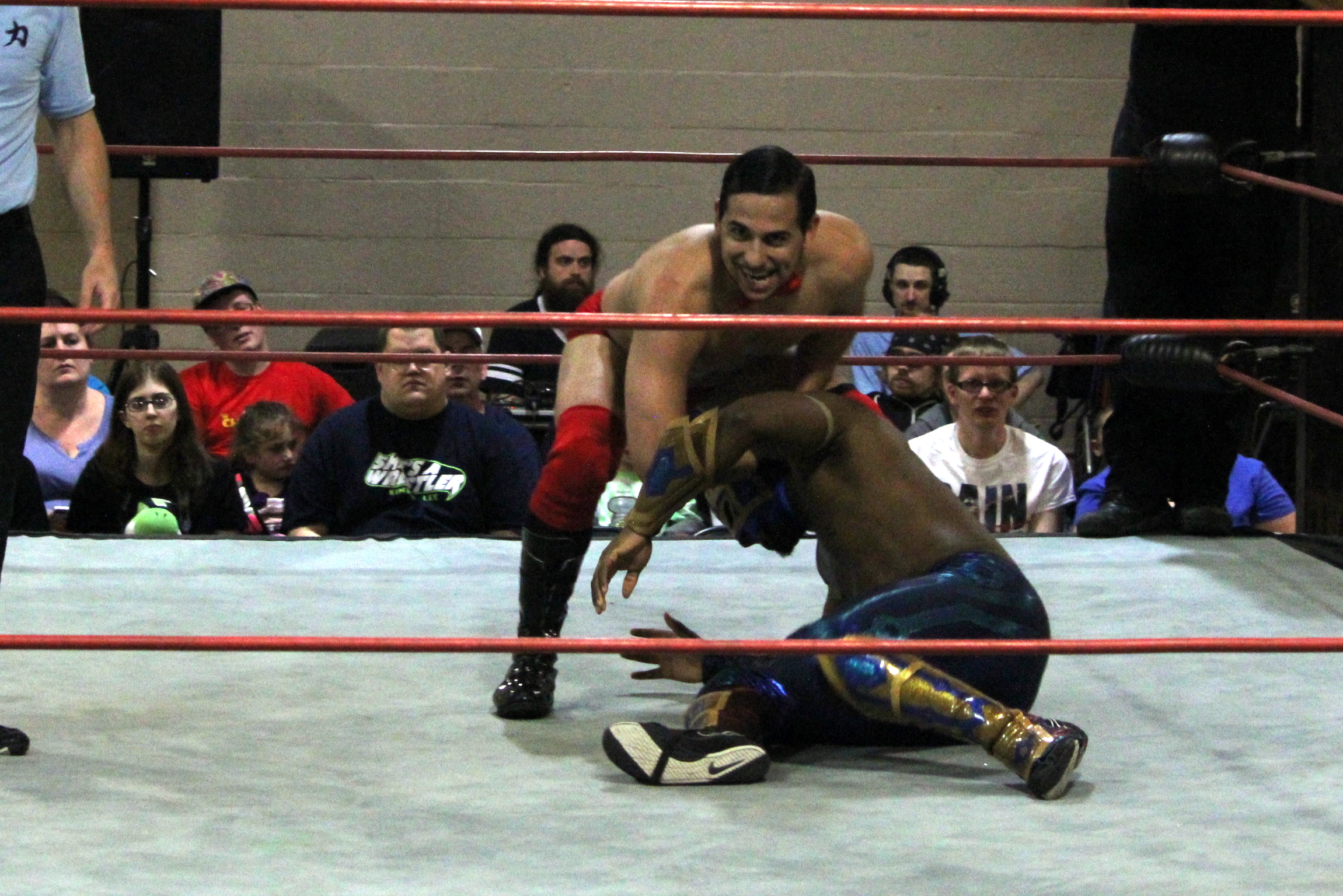two wrestling wrestlers wrestle in the ring on their knees