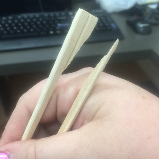 two wooden sticks sticking out of one another