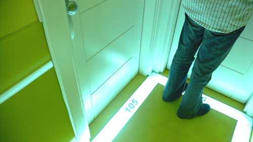 a person stands at a doorway with a sign that reads 360