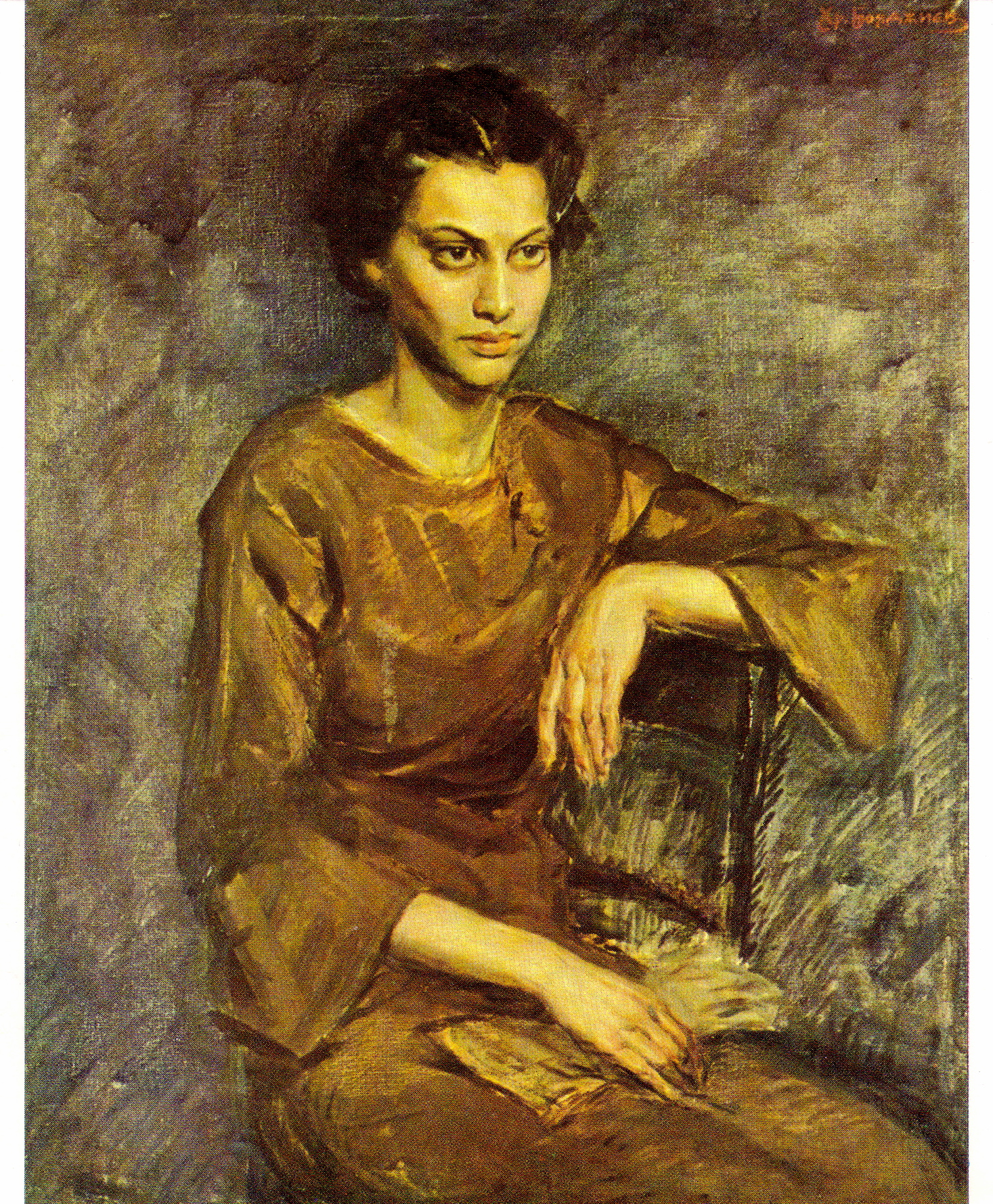 a woman sitting in front of a painting