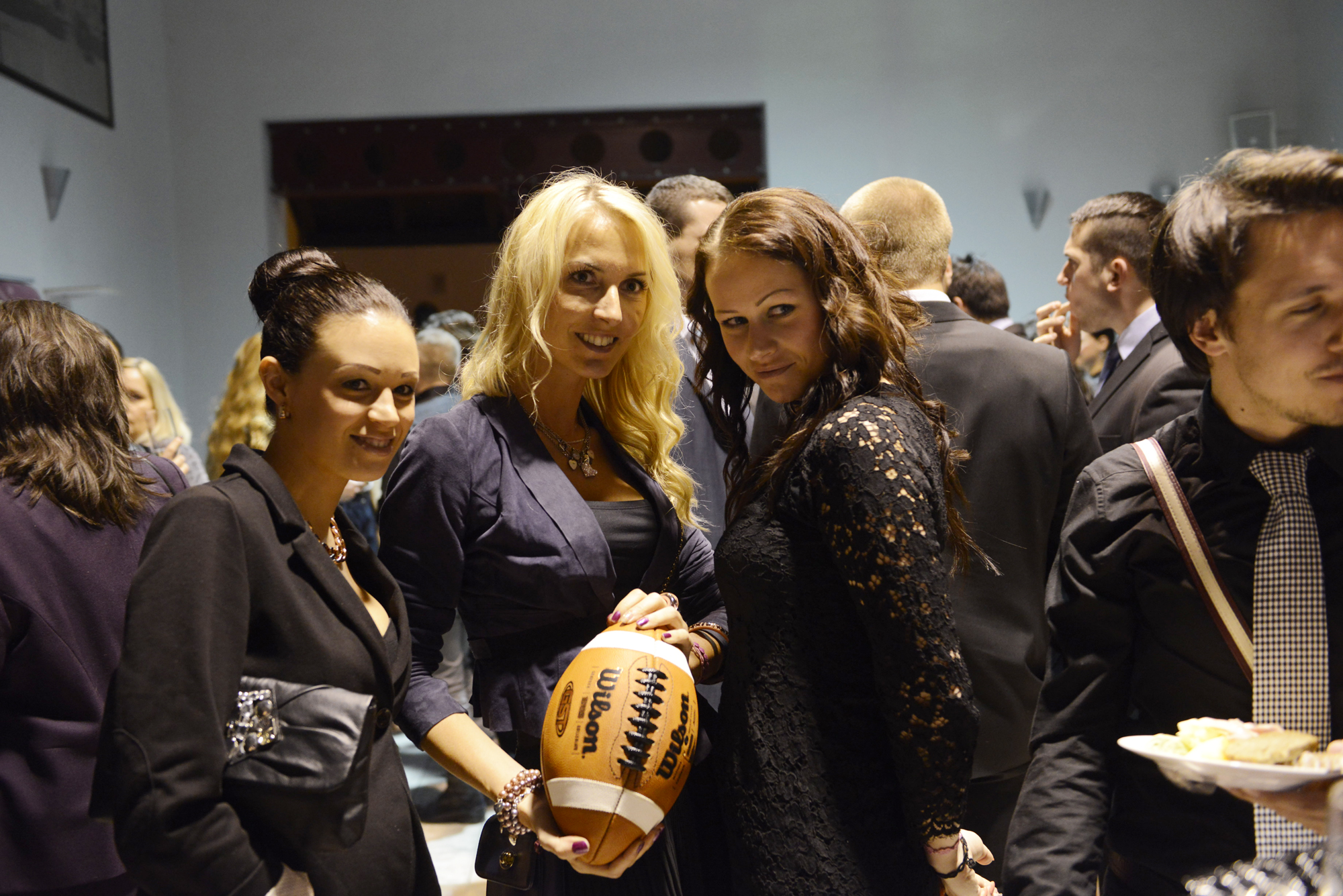 several young women holding basketballs and smiling at the camera