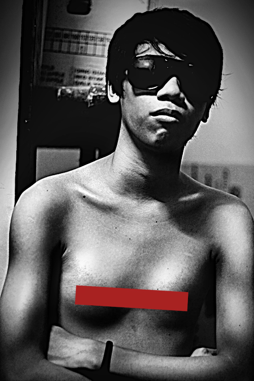 a male with an ad taped across his chest