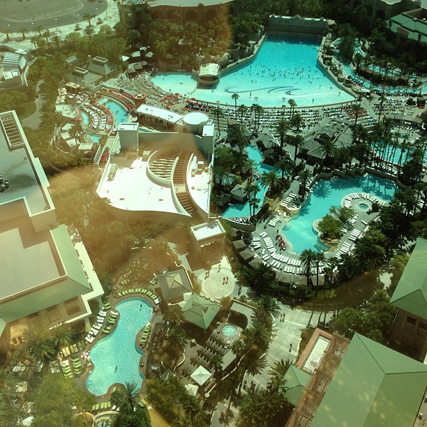 a po taken from the air looking down on a resort and swimming pool