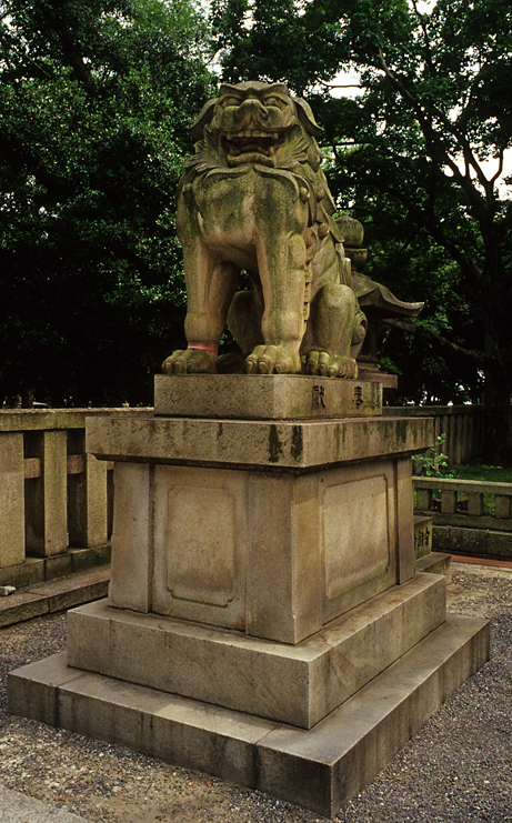 there is a statue of a lion on display