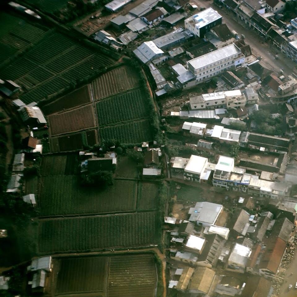 a view from above of a small town with houses