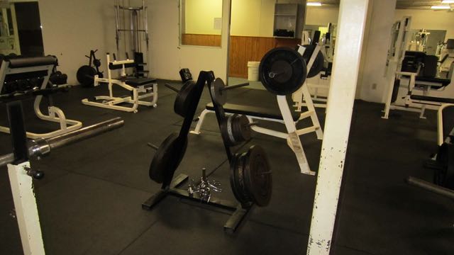 the weight room is clean and empty of people