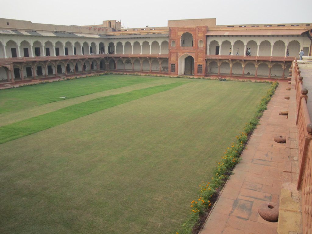 a view of an outside courtyard and some grass