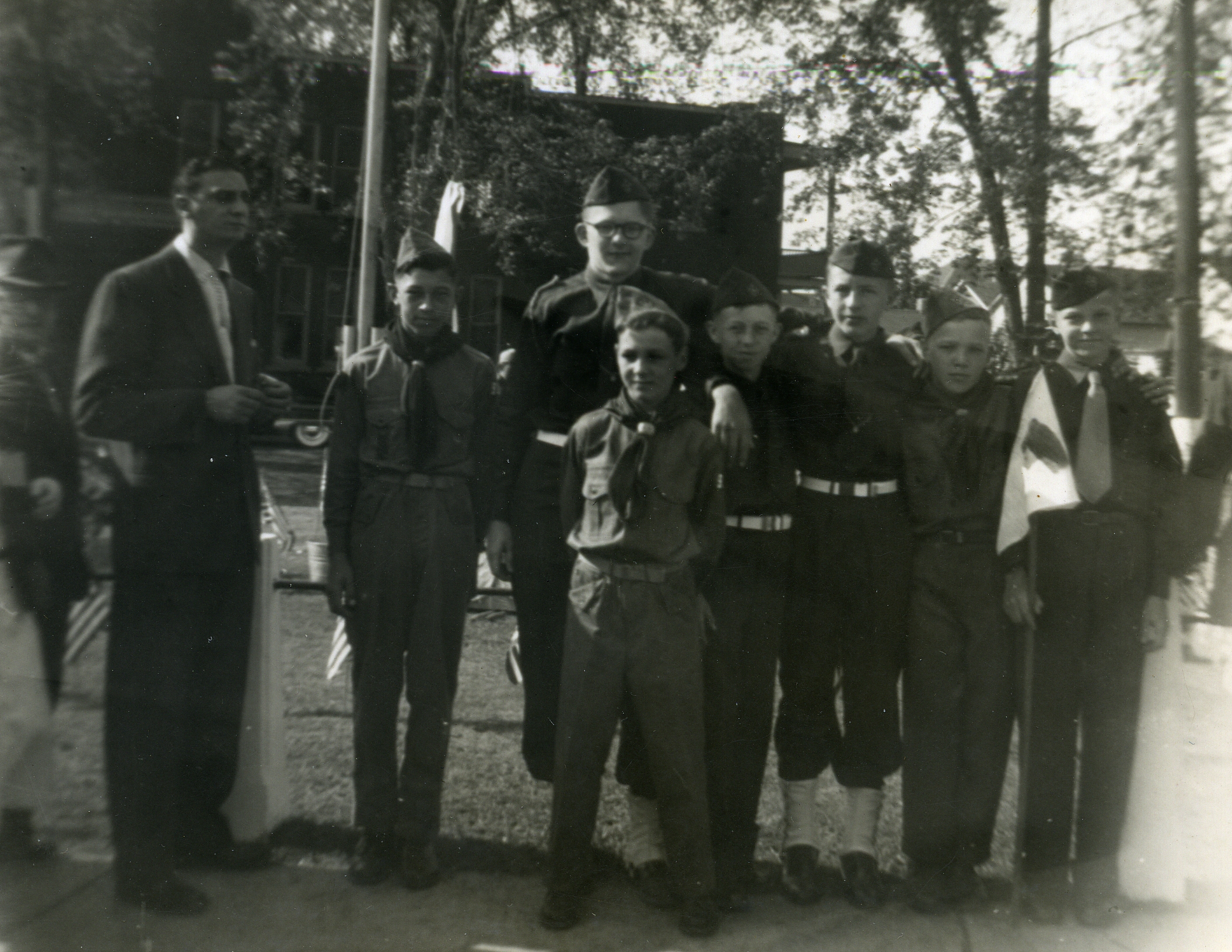 a group of men in suits standing next to each other