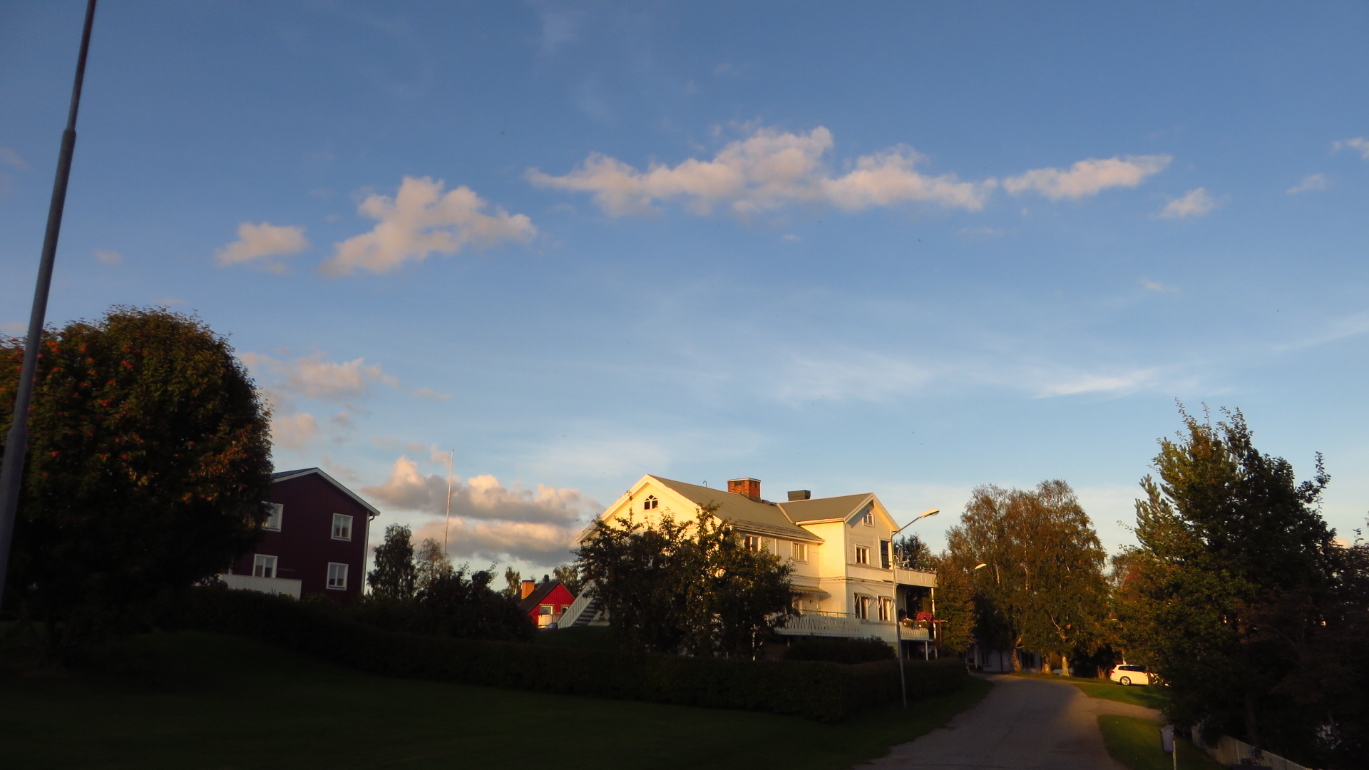 the house is standing alone on the small road