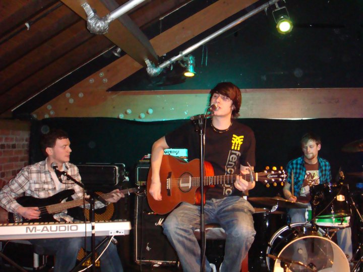 a band playing music in a music studio