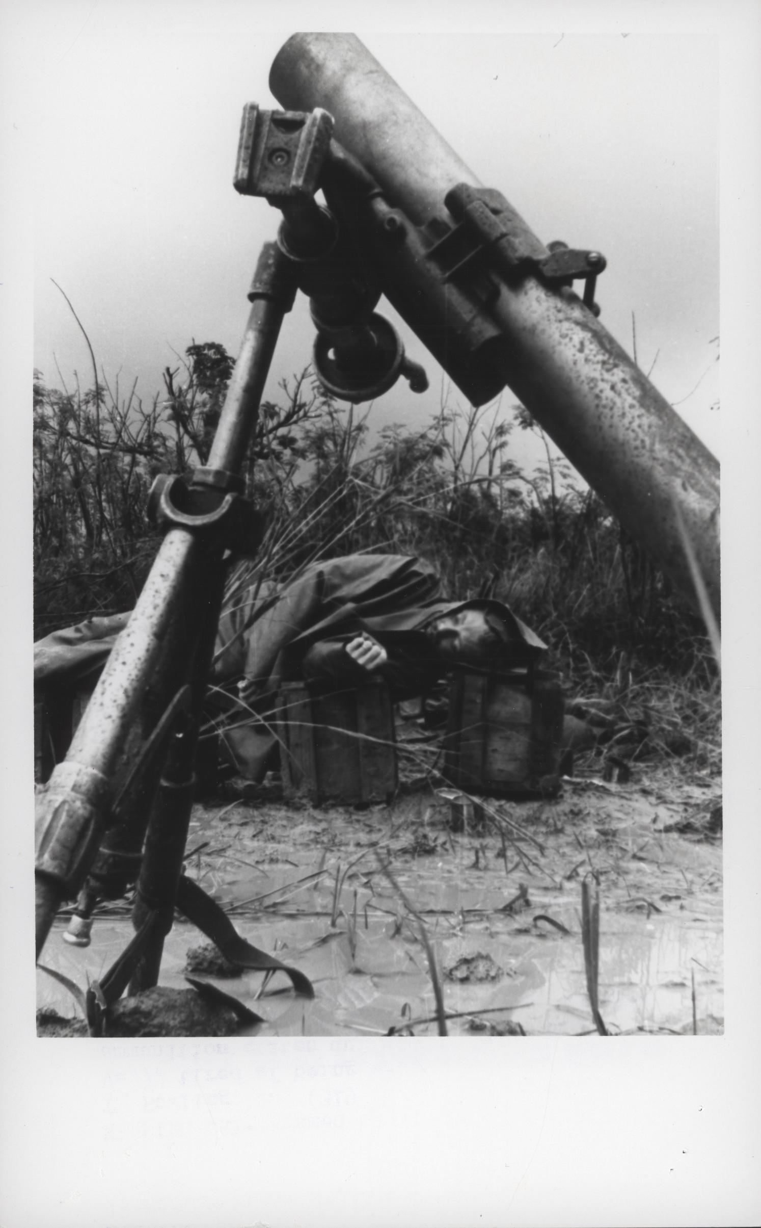 an old picture of soldiers guns lying in the sand