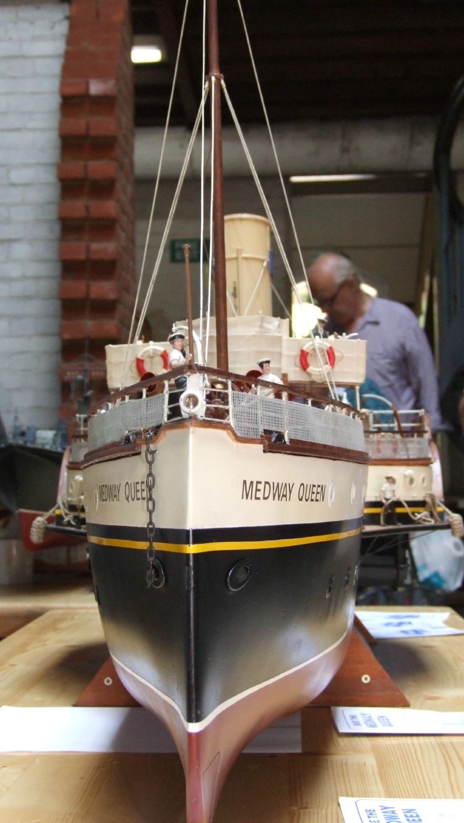 a model ship in a boat shop with other models