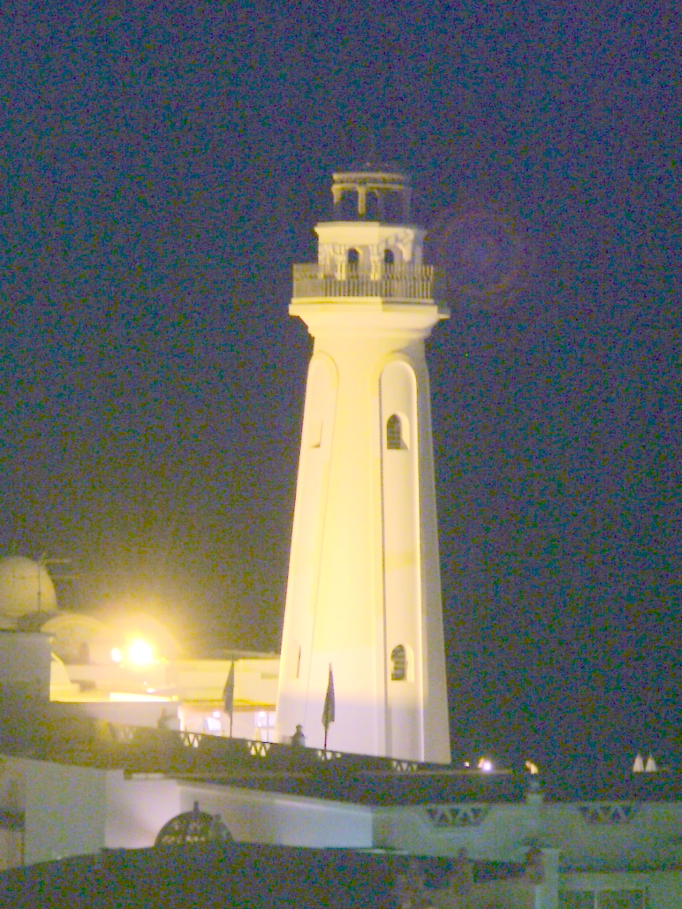 a very tall white tower with a clock at the top