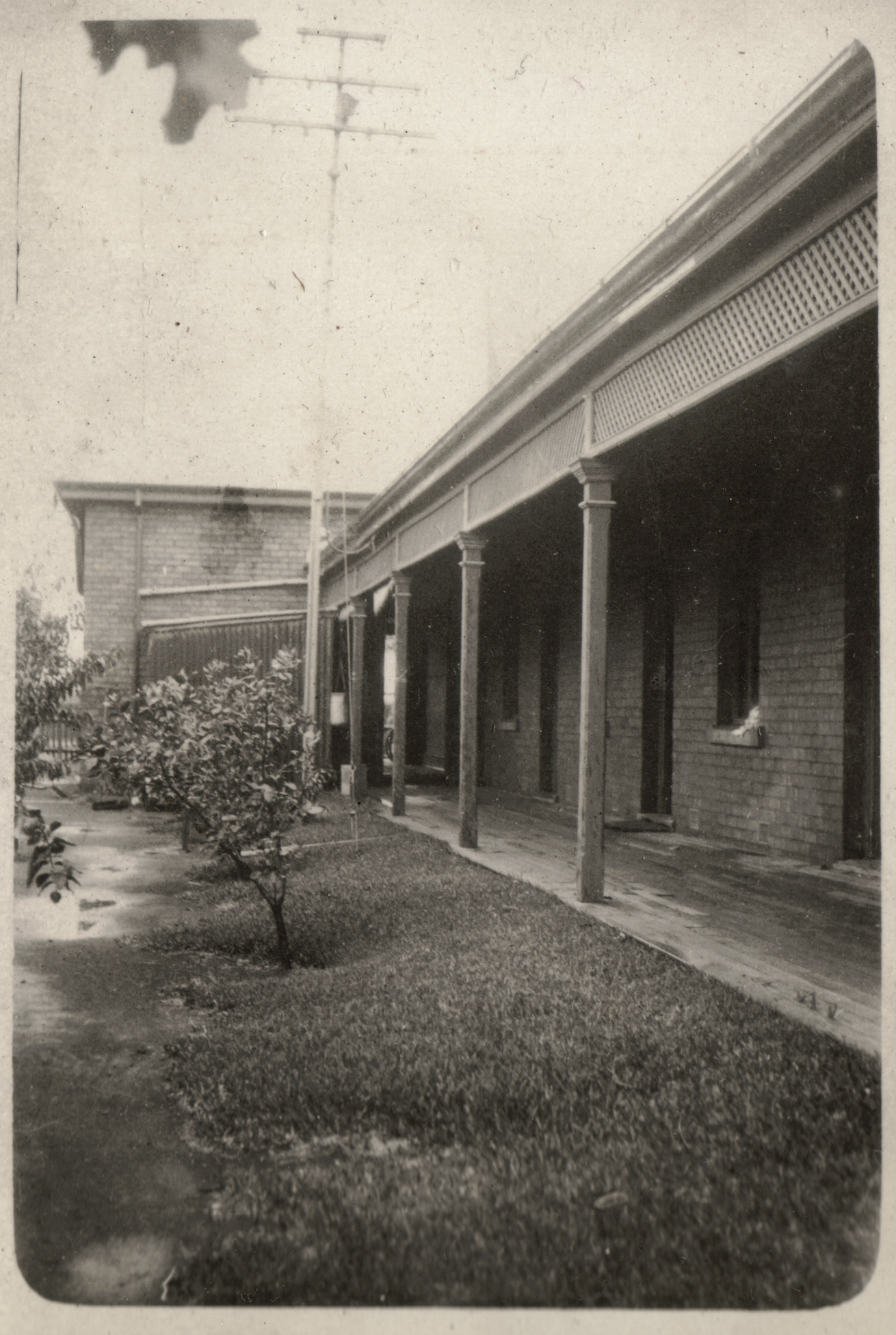 this is an old black and white po of an outside porch