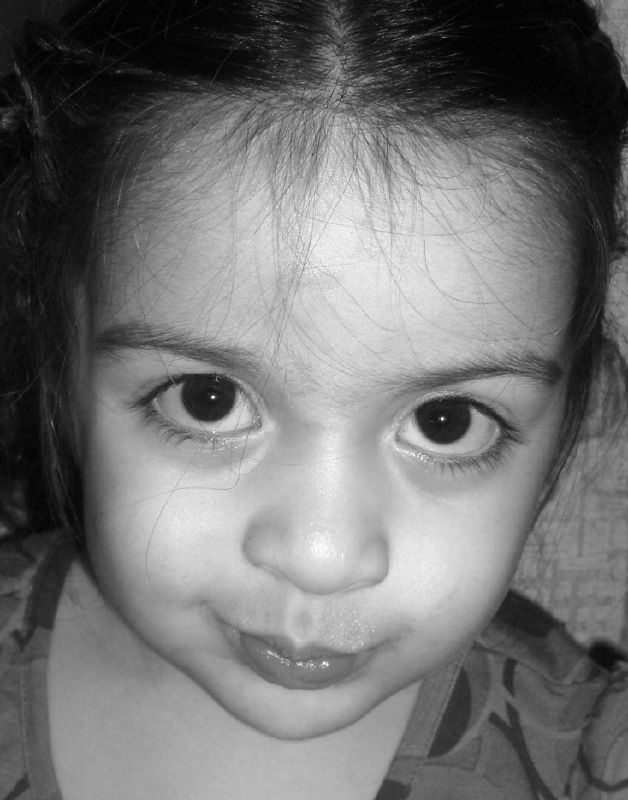 a close up view of a child with big eyes