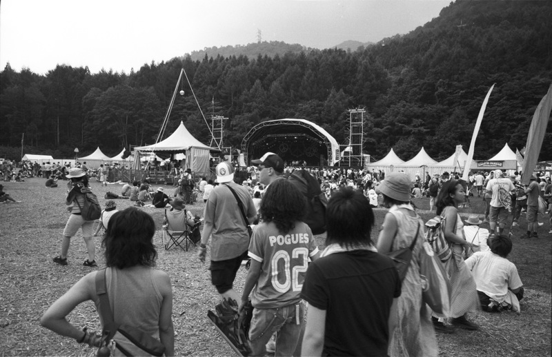 people are gathered outside at the festival