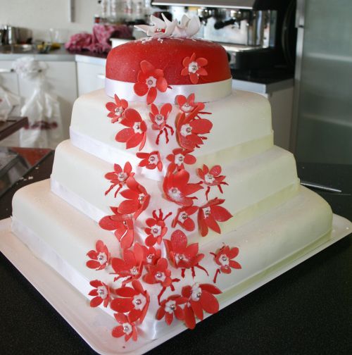 this cake has many flowers and petals on it