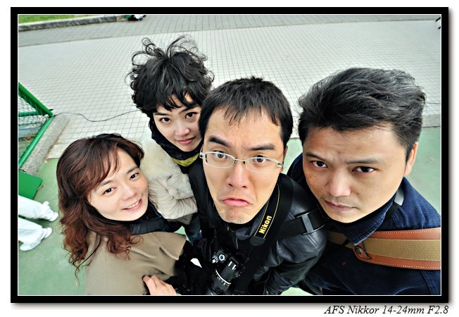 a po of five asian people with their camera around them