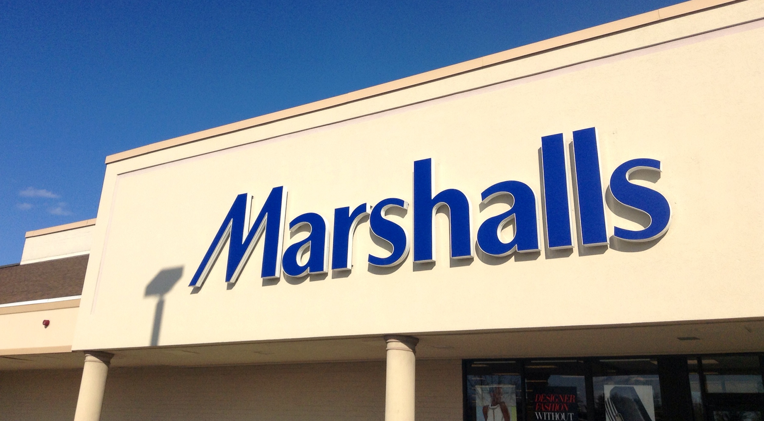 a store sign that reads marshalls above it is blue letters