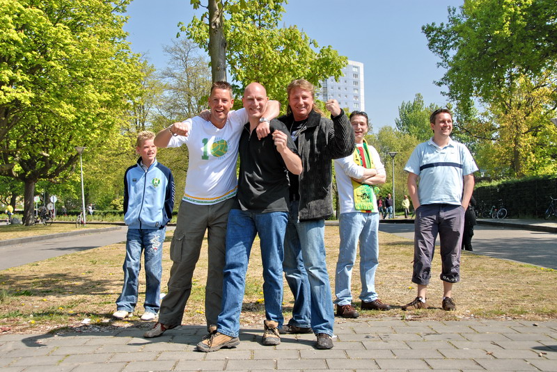 the people stand next to each other in the park