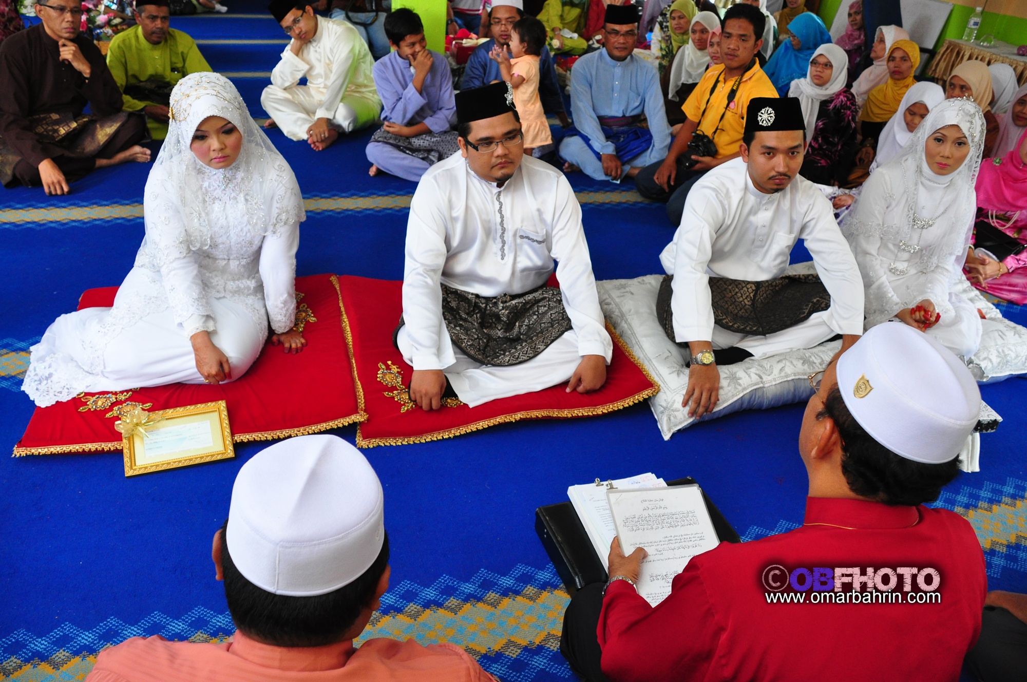 a group of people sitting down and reading