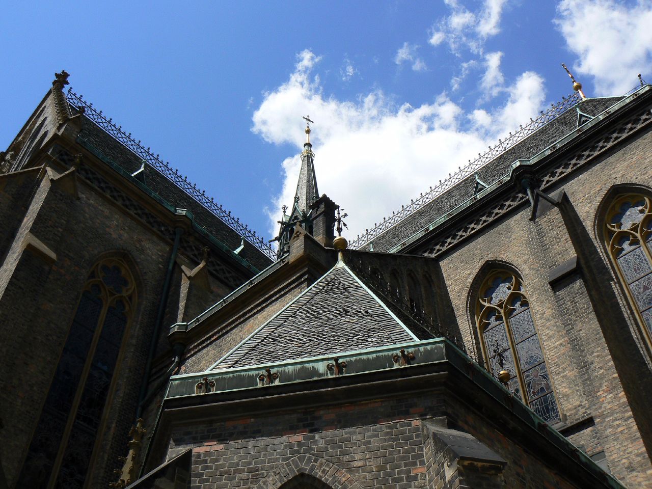 the building has several arched windows and ornate architecture