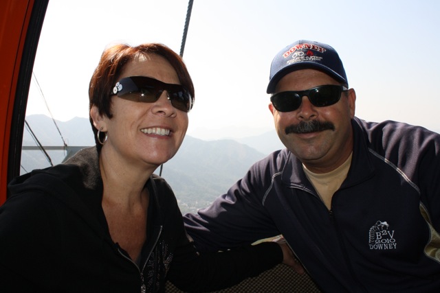 two people are posing together for a picture in a gondola