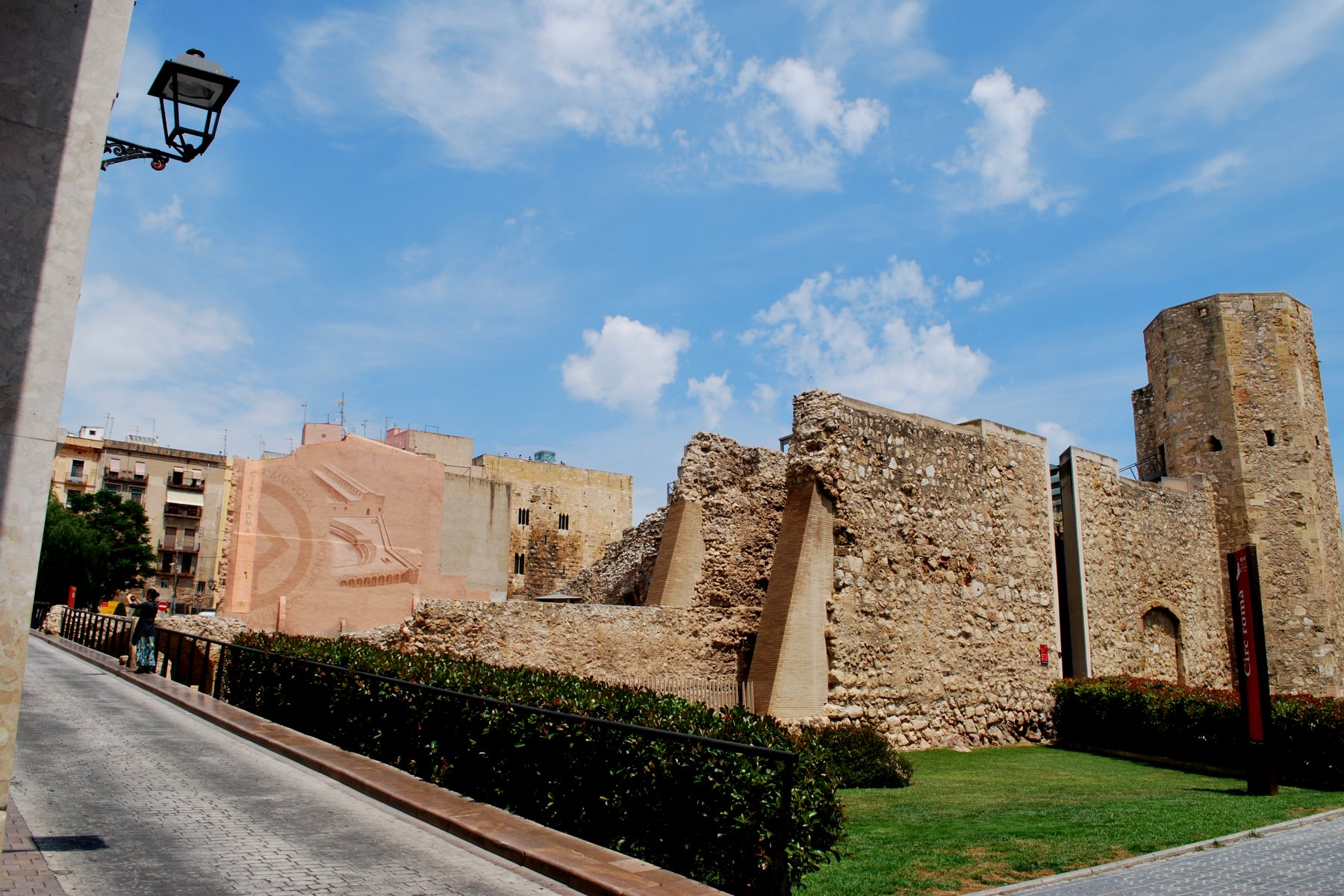 an old brick castle sitting on the side of a road