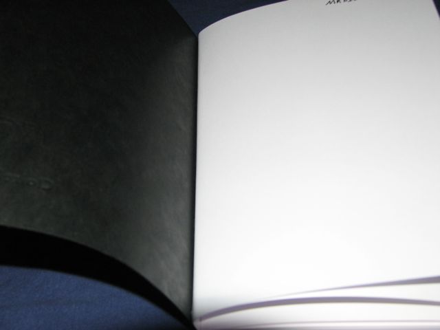 the top half of a book sitting open
